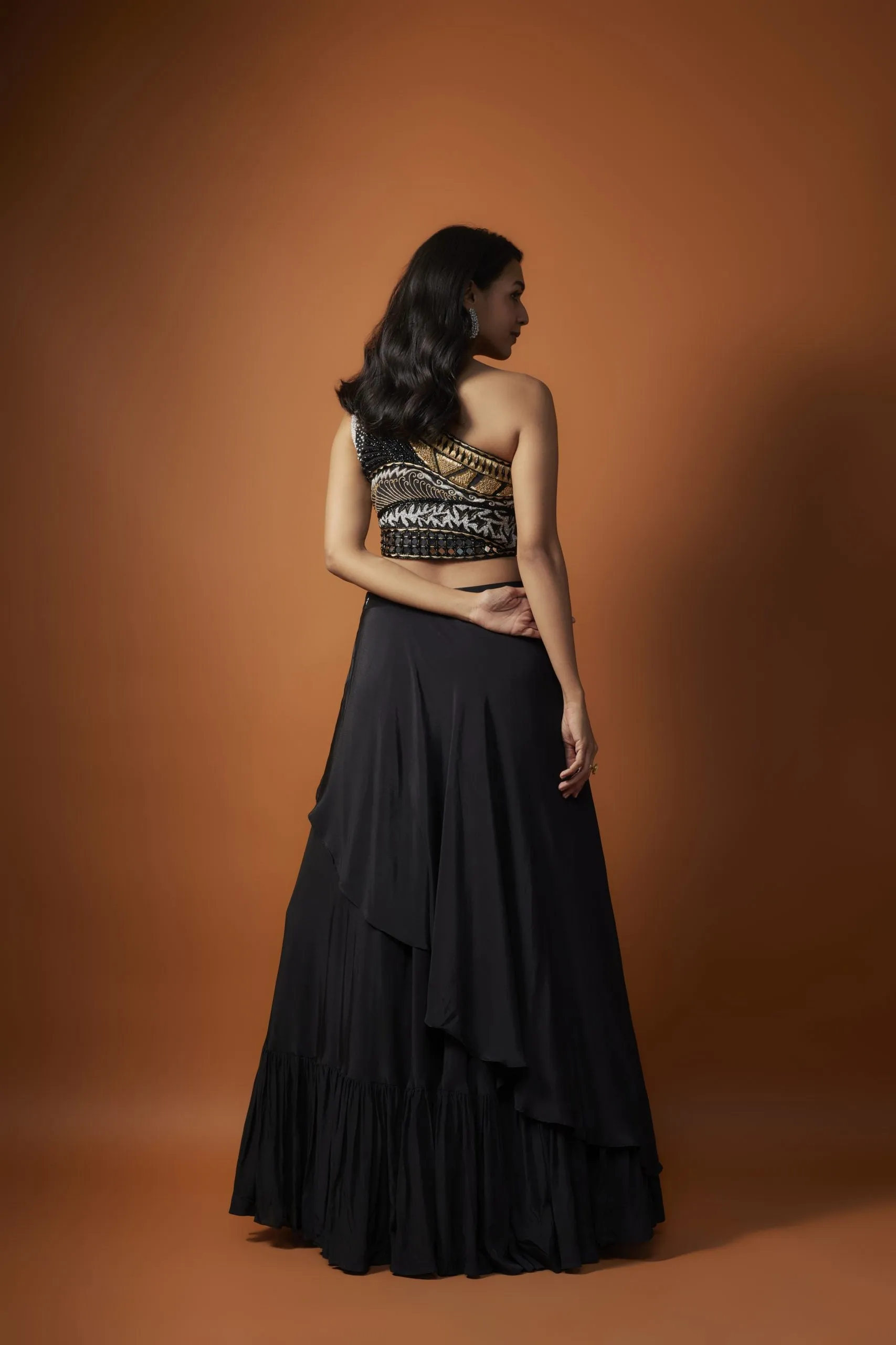 BLACK ONE SHOULDER EMBROIDERED CHOLI WITH ASYMMETRICAL LEHENGA SET